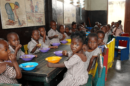 Children eating together at a table